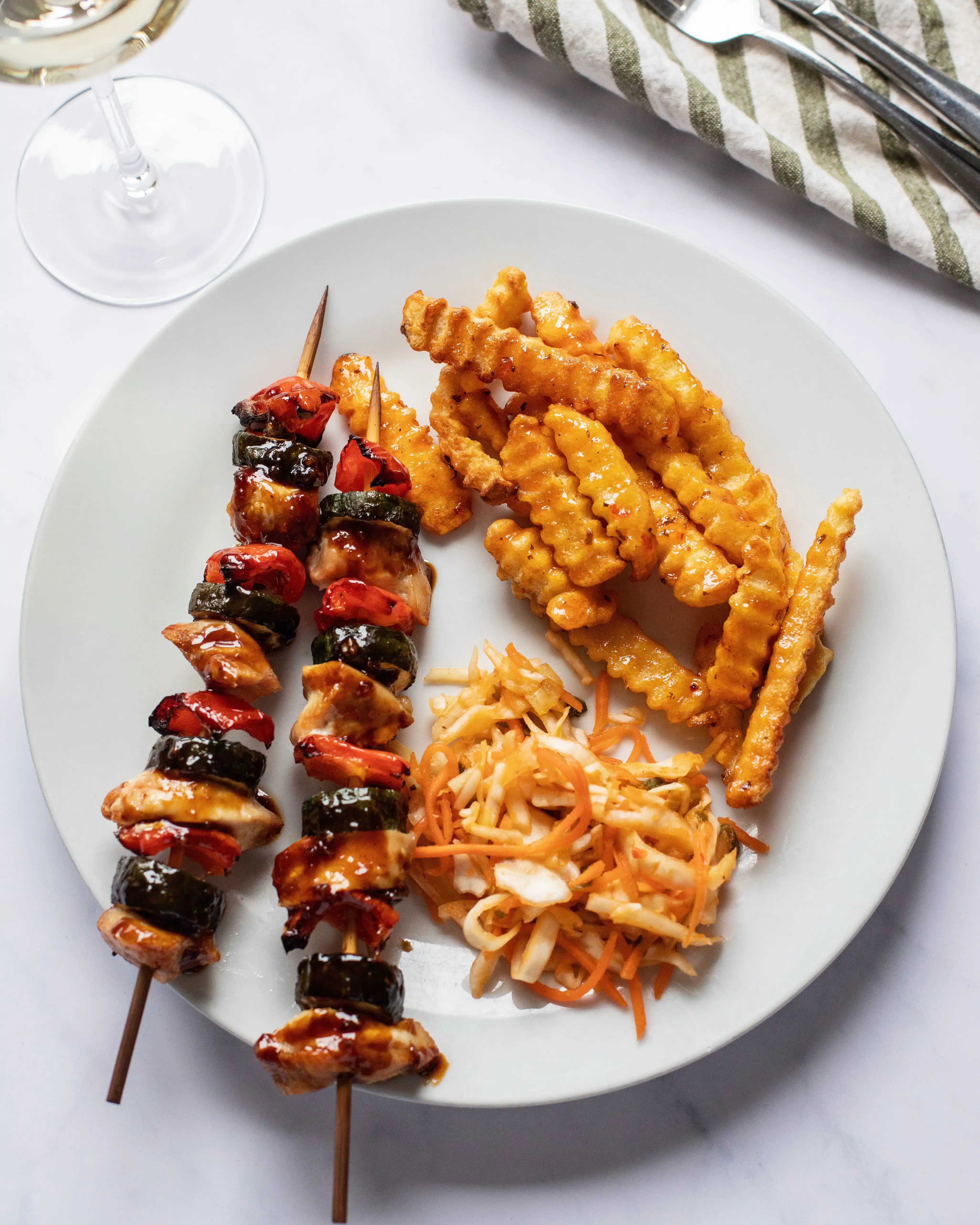 Asian-glazed chicken kebabs with Thai sweet chili sticky fries