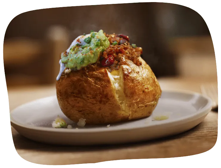 Loaded jacket potato with chilli and avocado